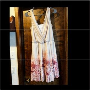 Size 4 Lauren Conrad dress. Peach overall color with floral design.